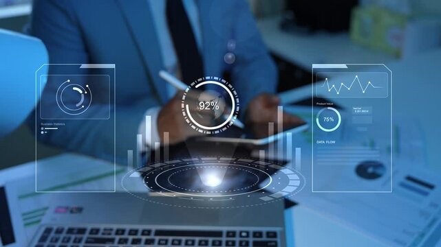 Holographic business analyst using digital dashboard with glowing charts and data graphs above a tablet in a modern office, Business analytics, finance, technology, and performance monitoring