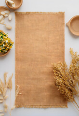 Fototapeta premium Natural rustic background with burlap fabric dried flowers and wooden bowls organic texture for product display