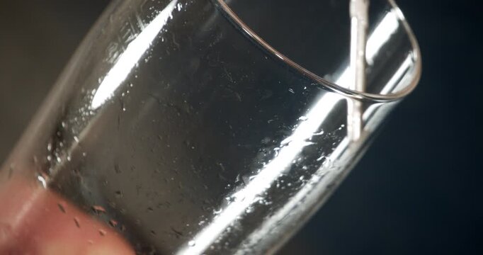 Beer being filled into glass close up in industrial factory brewery