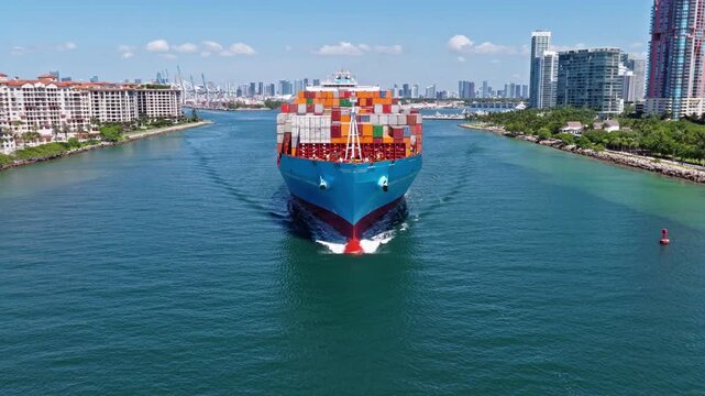 Miami, Florida, USA - May 21, 2025: Aerial view cargo ship. Cargo business 4k. Container ship. Cargo ship Maersk Monte Pascoal with container in Miami. Freight container loaded on cargo vessel