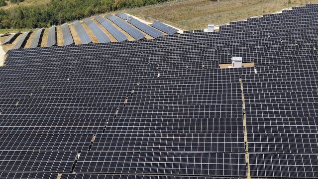 Aerial view of the 9,9 MW solar power plant featuring rows of photovoltaic panels installed in a rural landscape in Lapovo, Sumadija District, Serbia.