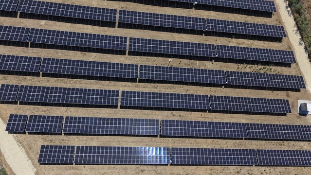 Aerial view of the 9,9 MW solar power plant featuring rows of photovoltaic panels arranged in a field in Lapovo, Sumadija District, Serbia.