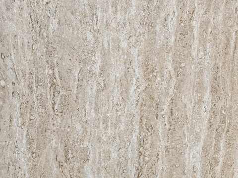 High resolution close-up texture of polished beige travertine marble stone surface featuring natural porous grain pattern target for architectural interior design rendering luxury wall tile background