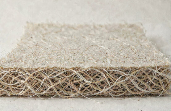 Nonwoven fibre matting slab layered edge with a plain backdrop