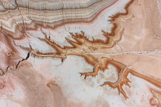 Aerial view of the dramatic limestone rock formations and eroded canyons of the Bozhira tract, showcasing intricate geological patterns in Karakiya District, Mangystau Region, Kazakhstan.