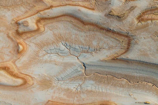 Aerial view of the eroded limestone formations and intricate sedimentary layers of the Bozhira canyon landscape in the Karakiya District, Mangystau Region, Kazakhstan.
