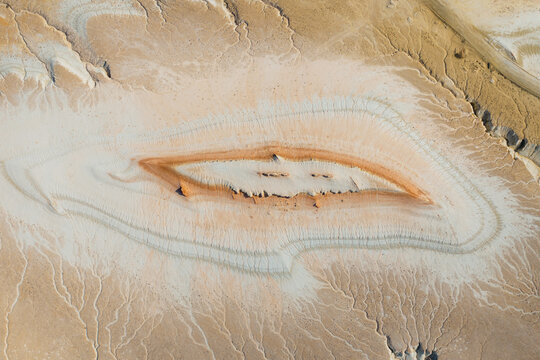 Aerial view of Bozhira with its unique geological rock formations and intricate erosion patterns across the arid desert landscape in Karakiya District, Mangystau Region, Kazakhstan.