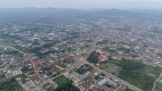 Aerial view of Oye town featuring residential buildings, roads, and surrounding lush greenery in Oye, Ekiti, Nigeria.