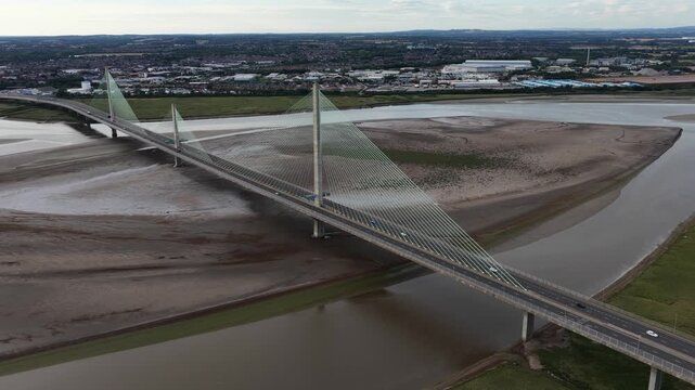 Aerial view of mersey gateway bridge traffic crossing river