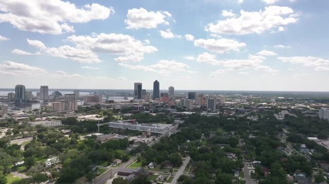  Aerial Drone View of Downtown Jacksonville, Florida Skyline Surrounded by Lush Green Trees&rdquo;