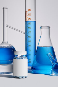 Blue liquids and multivitamins on table