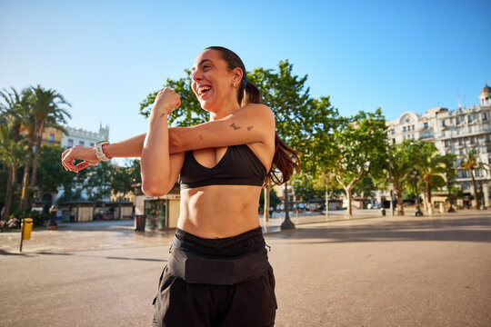 Running warm up in the park near the city center during the morn