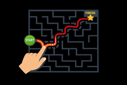 A hand presses a button to enter a maze