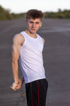 Teenage boy flexing his muscles