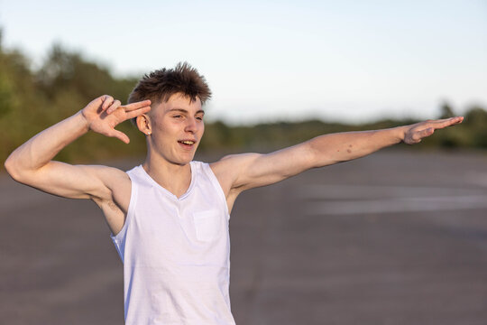 Teenage boy flexing his muscles