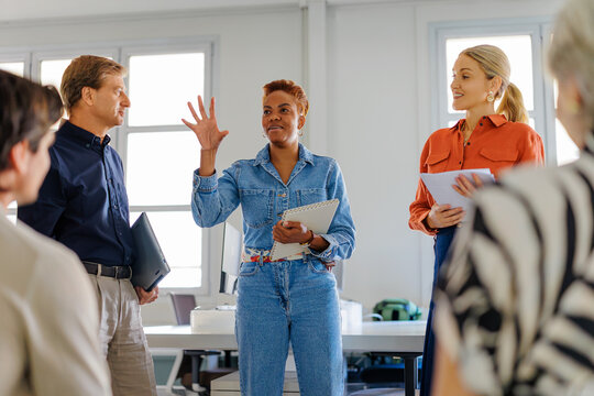 Business group discussing strategy in office