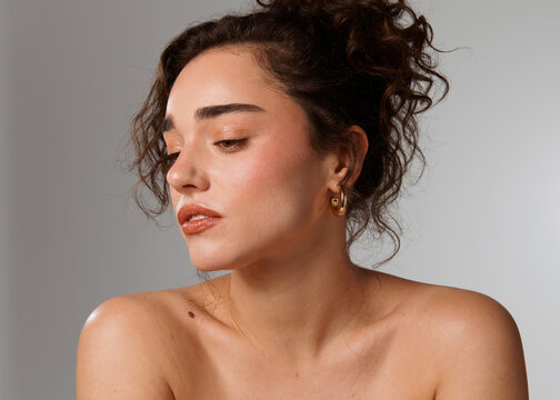Portrait of a Woman Looking to the Side With Curly Hair
