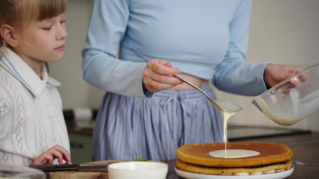 Close-up: pouring cream over golden pancake, tactile texture, 25 fps