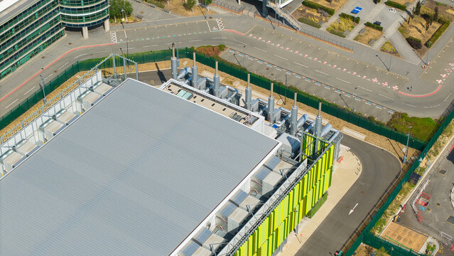 Aerial view of data center facility featuring containerised diesel generators and cooling systems for AI infrastructure in Harlow, England, United Kingdom.