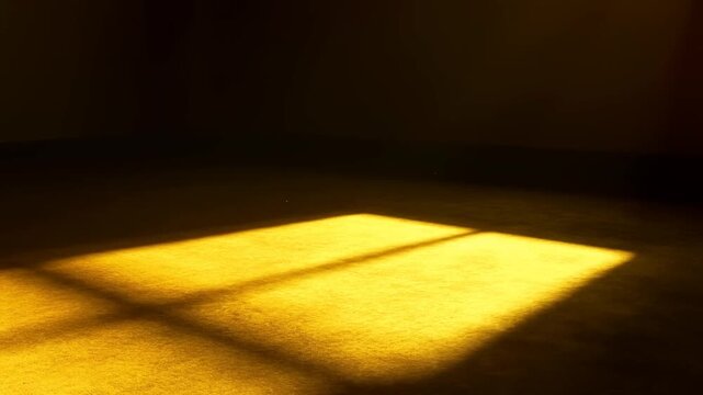 Sunlight beam projecting rectangular shape onto dusty floor in dark empty room interior