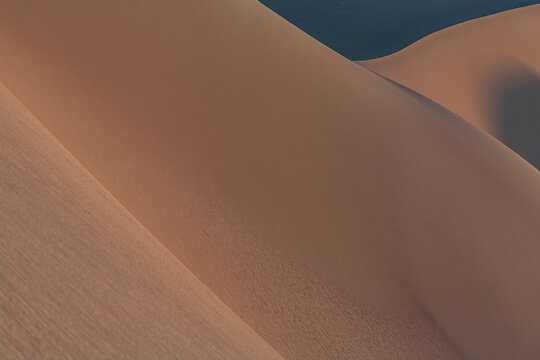 Beautiful minimal abstract sand dunes texture with shadows in desert