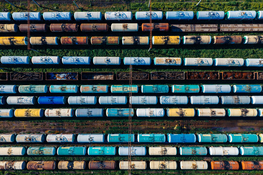 Aerial view of Batumi Railway Station with numerous colorful freight train cars lined up on parallel tracks in Batumi, Adjara, Georgia.