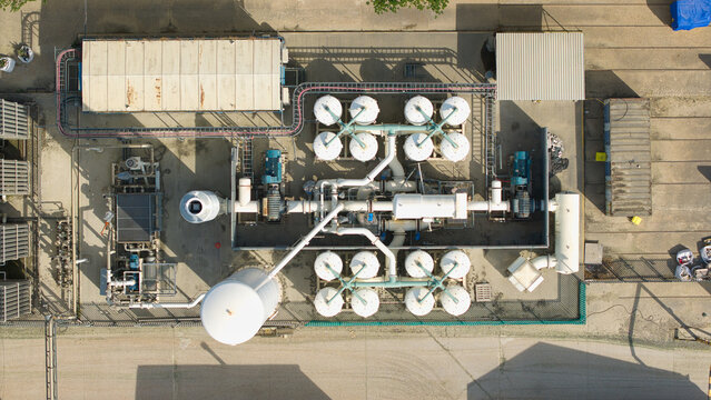 Aerial view of cryogenic storage tanks and gas vaporization systems at a glass manufacturing facility in Harlow, England, United Kingdom.