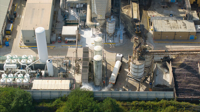 Aerial view of cryogenic storage tanks and gas vaporization systems at a glass manufacturing facility in Harlow, England, United Kingdom.