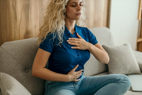 Woman practicing deep breathing exercise for stress relief