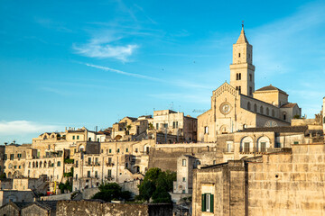 Fototapeta premium Matera, Basilicata, Italy: view of the Civita neighborhood, home to the Cathedral of Matera, the rocky promontory that divides the two historic districts of the Sassi