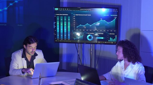 Business professionals collaborating in a modern office, analyzing digital dashboards and financial data, discussing market trends, business performance, data visualization, strategic planning.