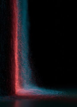 Close-up of a red and blue powder explosion on a black background. the powder appears to be in motion, creating a sense of movement and energy.