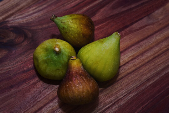 Closeup of figs on a wooden tray
