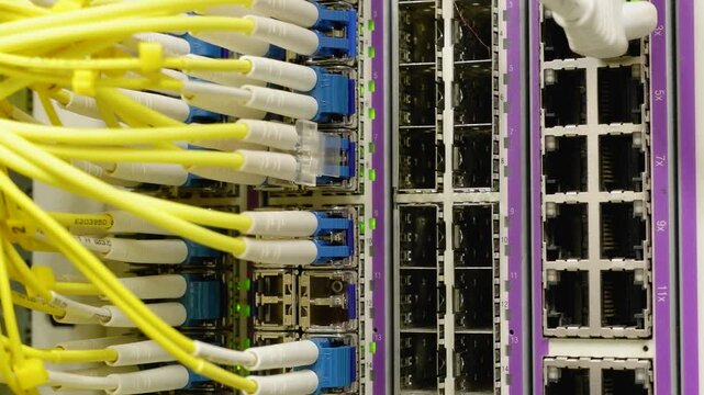 Fiber Optic Network Switch Close-Up Pan Data Center 4K