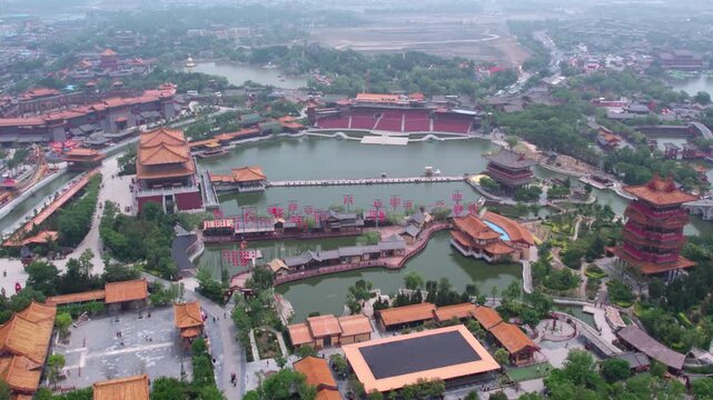 Aerial shot of a traditional Chinese cultural scenic area with lakes, pavilions and pagodas.