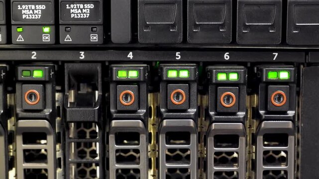 4K Close-Up Pan Across Server SSD Drive Bays Green LED Status