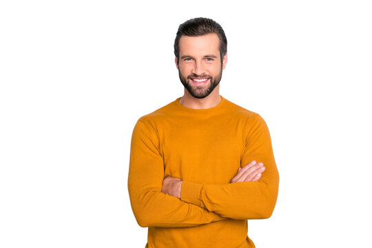 Portrait of attractive self-assured with beaming shiny smile haircut with long furfur wearing casual classic color of mustard sweater macho man standing with folded arms isolated on gray background