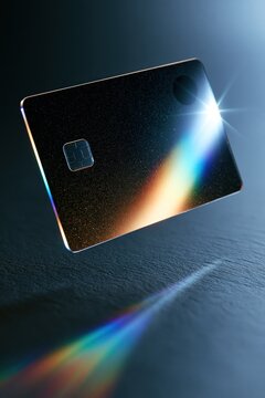 Transparent credit card with chip and prism light on a dark background for fintech, digital banking, and luxury payment concepts.
