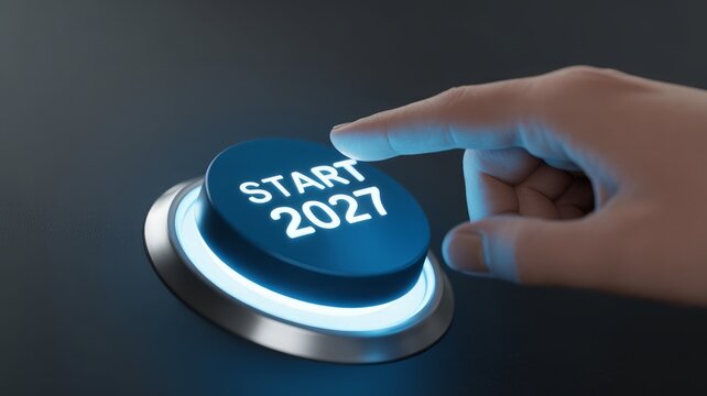 Hand pressing start button for year 2027