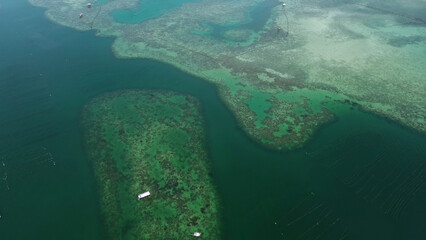 Coral reef and fish farm with cages for fish © Kokhanchikov