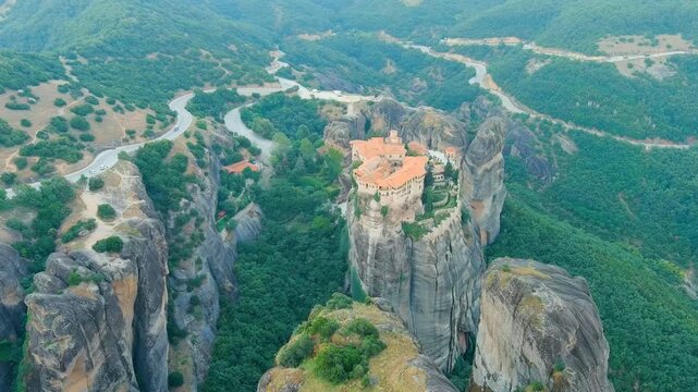 Meteora, Kalabaka, Greece. Monastery of Varlaam. Meteora - rocks, up to 600 meters high. There are 6 active Greek Orthodox monasteries listed on the UNESCO list. Drone footage, Point of interest