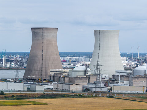 Aerial view of Doel Nuclear Power Plant with its iconic cooling towers and industrial infrastructure situated along the river in Beveren, Vlaanderen, Belgium.