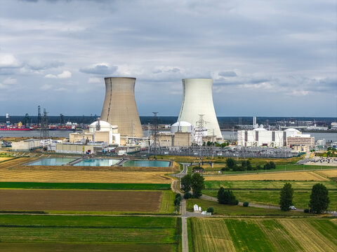 Aerial view of the Doel Nuclear Power Plant with its cooling towers, surrounded by agricultural fields and the Scheldt river in Beveren-Kruibeke-Zwijndrecht, Vlaanderen, Belgium.
