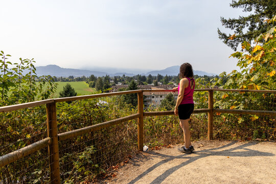 Woman Standing at Little Mountain Stairs Overlook in Chilliwack BC Canada Looking Over Valley