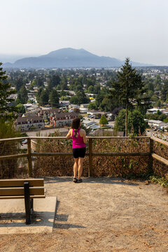 Woman Enjoying Scenic City and Mountain View From Little Mountain Stairs Overlooking Chilliwack BC Canada