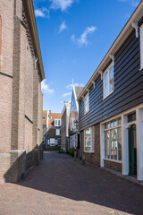 Naklejka premium Marken is a peninsula connected by a causeway to the waters of Lake Ijssel, in the Netherlands, located in the municipality of Waterland in the province of North Holland. 