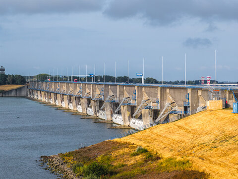 Aerial view of Haringvlietdam featuring concrete sluice gates and water control infrastructure in Hellevoetsluis, South Holland, Netherlands.