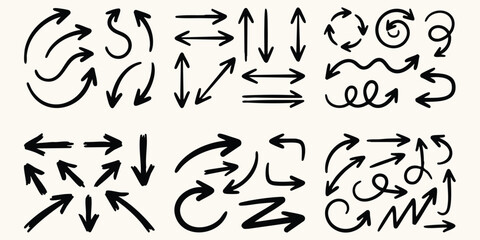 Various hand made doodle arrows in different directions against a light background for directional concepts © Ishtiaq