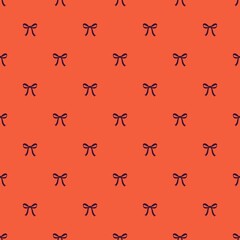 Fototapeta premium Minimal bright red background with dark blue ribbon bow graphic elements. Seamless repeat pattern for festive gift wrapping paper and party invitation card design. Perfect for autumn banner background