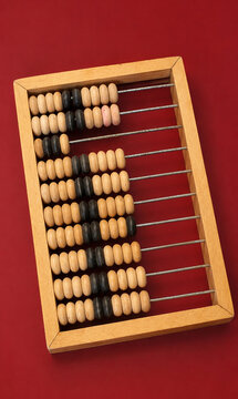 Wooden Abacus for Counting and Arithmetic on Red Background